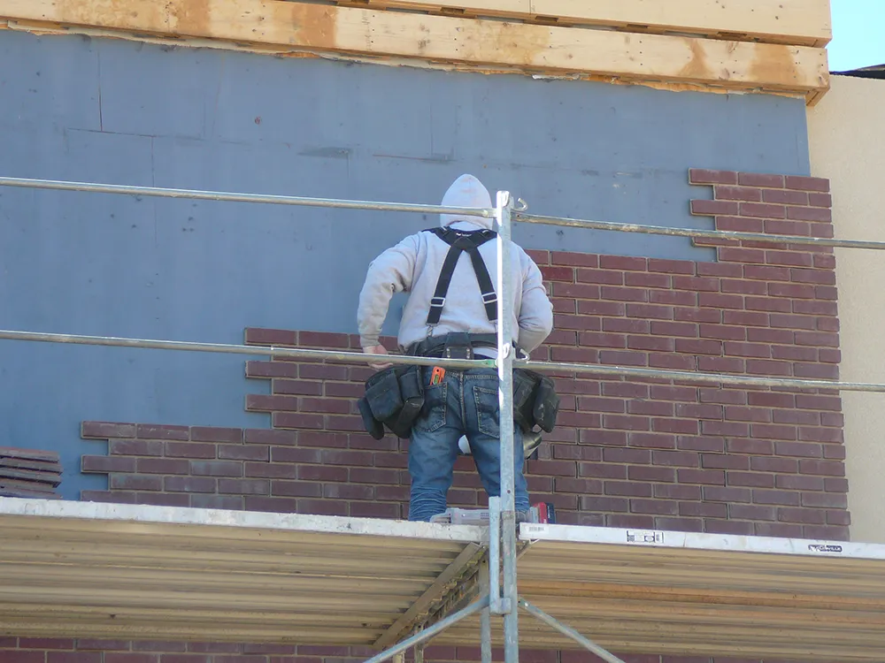 IQ Brick works at Red Robin doing installation